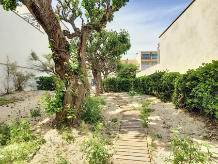 Appartement T4 en bord de plage avec terrasse et parking à Carnon - Photo 17