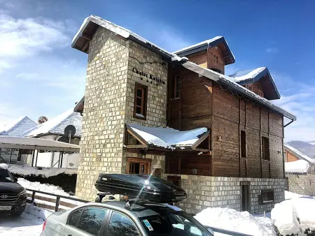 Die Ski-Suite hat ein Schlafzimmer und ein kleines Wohnzimmer ohne Küche. - Photo 35