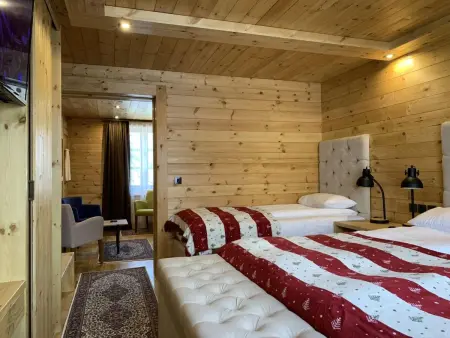 Die Ski-Suite hat ein Schlafzimmer und ein kleines Wohnzimmer ohne Küche. - Photo 46