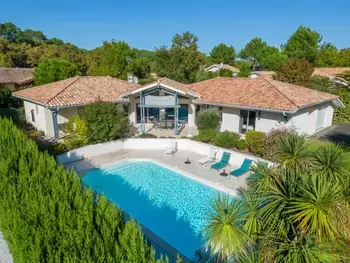 Villa à Biscarrosse, Villa familiale avec piscine chauffée, clim, 4 chambres, proche golf et plages - L1005830