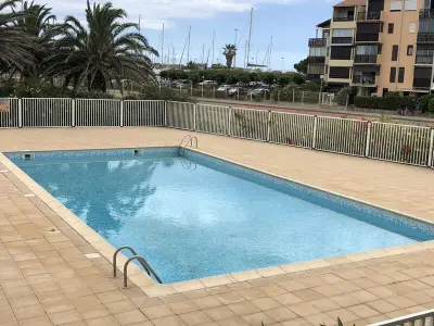 Appartement à Saint Cyprien, Saint Cyprien - T2 RDC 4P avec piscine, proche plage et port, parking privé, animaux admis - L1007818