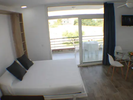 Appartement à Roses, Appartement cosy à Roses avec piscine et jardin - Idéal pour 4 pers. - L1073755